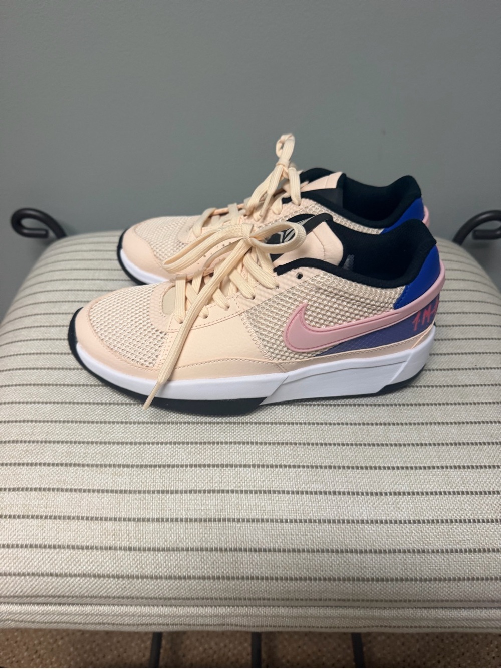 Nike Women's Light Peach and Pink Low-Top Sneakers with Blue Accents